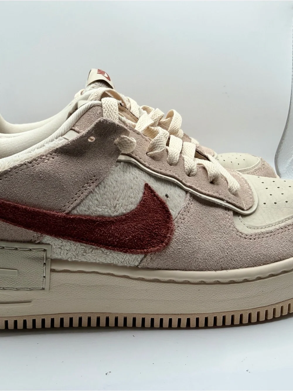 Nike Women's Low-Top Sneakers in Cream with Rust Swoosh